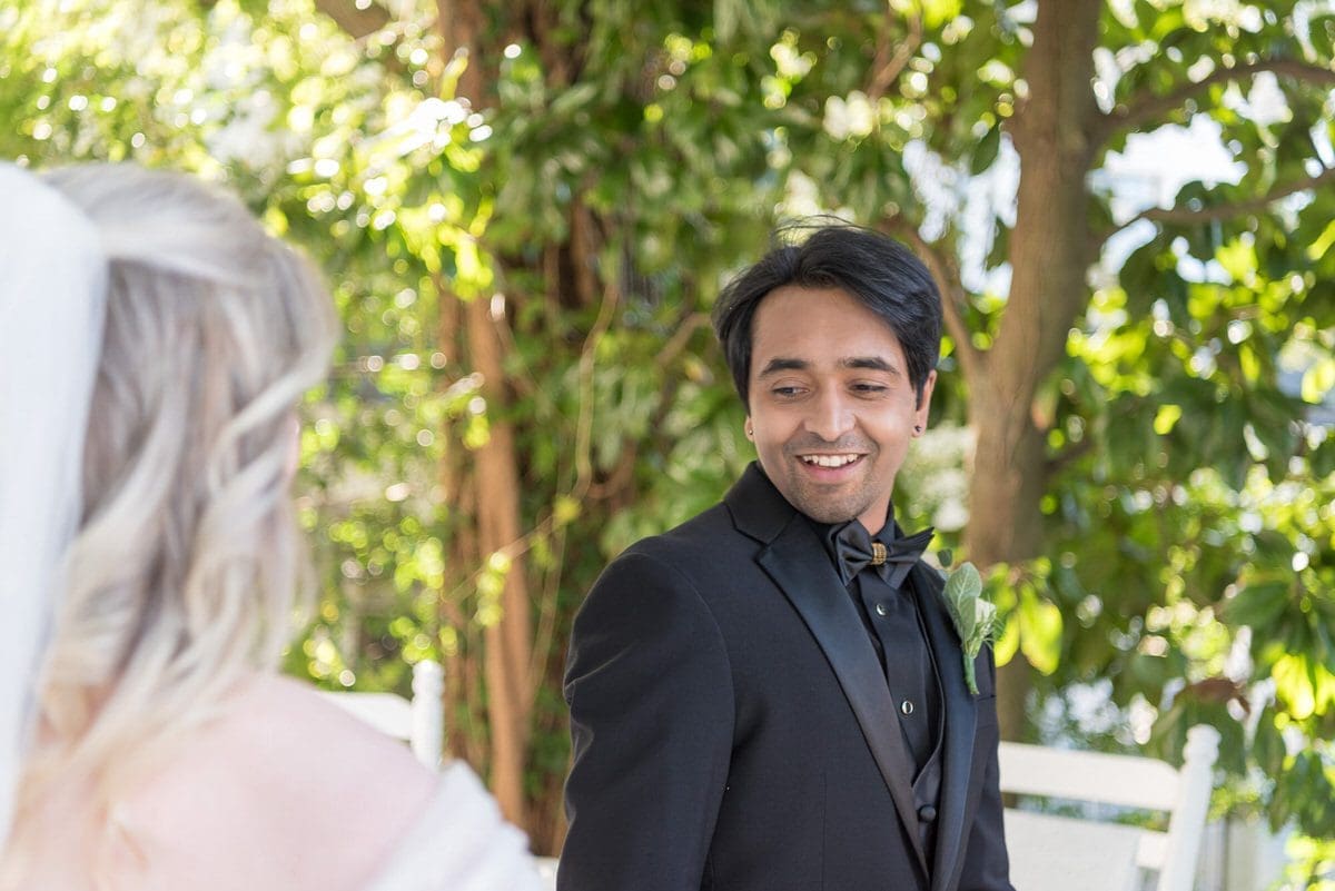 Whitlock Inn Wedding Photographer - groom sees bride for first time (first look)